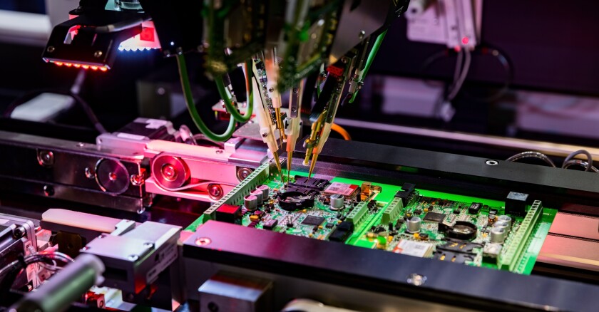Electronic circuit board production and computer chip fly test by robotic automated machine
